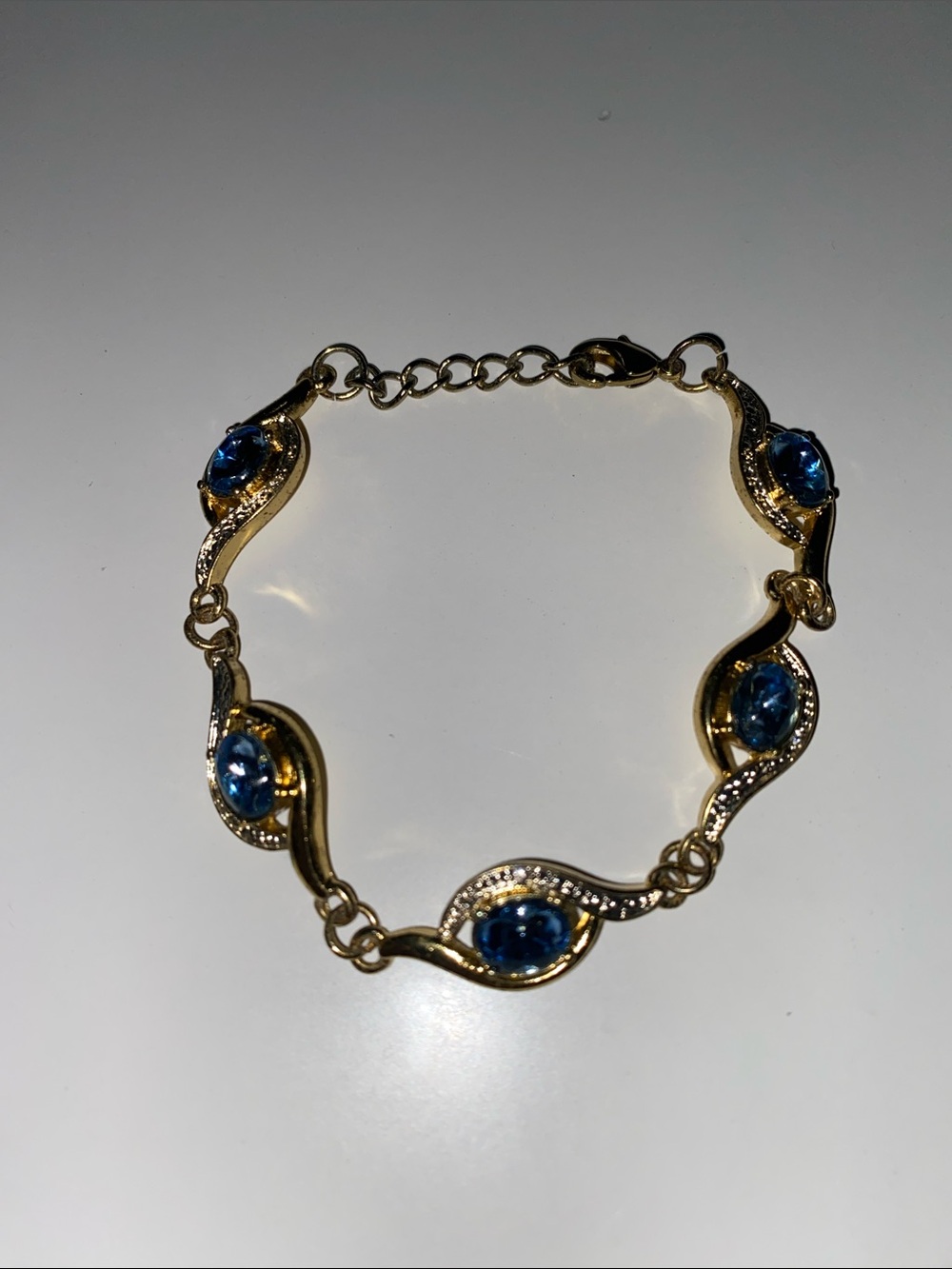 Gold-Tone Bracelet with Blue Gem Accents